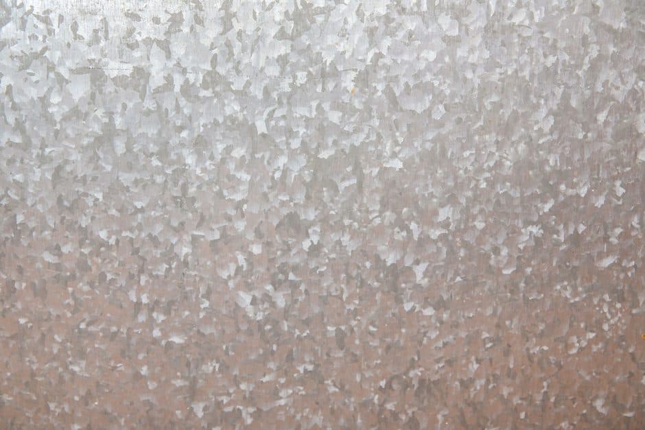 A brushed metal surface photographed close up.